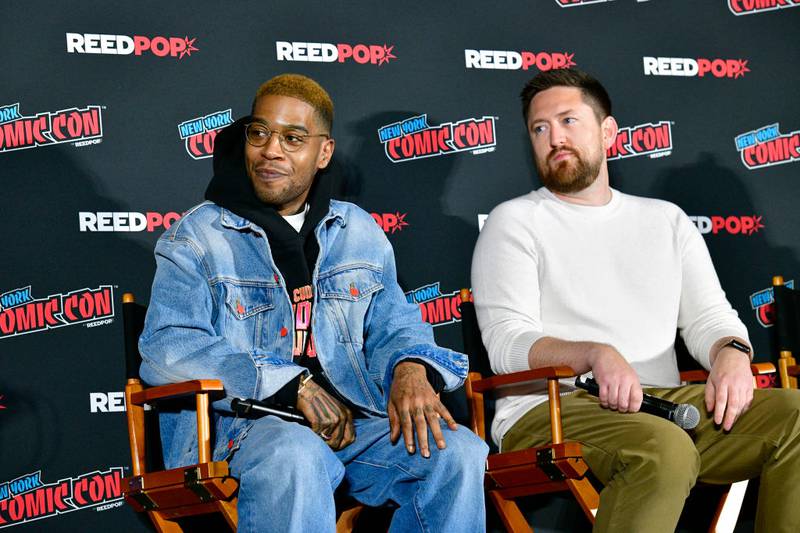NEW YORK, NEW YORK - OCTOBER 14: (L-R) Kid Cudi and Marco Locati speak at a panel announcing the comic book "Moon Man" during New York Comic Con 2023 - Day 3 at Javits Center on October 14, 2023 in New York City. (Photo by Eugene Gologursky/Getty Images for ReedPop)