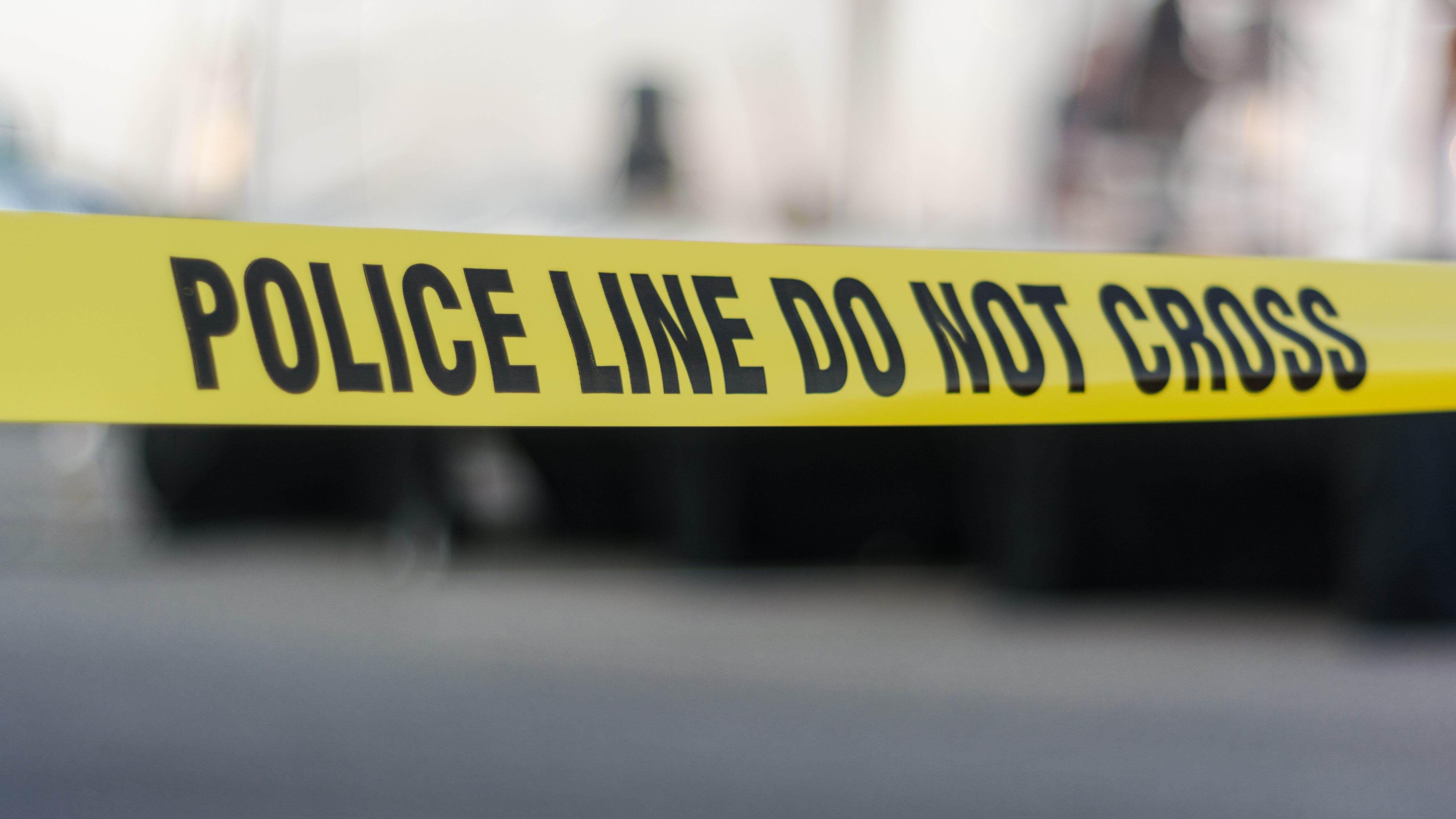 Yellow police tape with text: